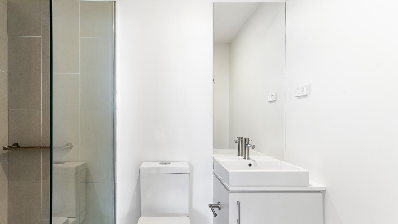Image of a contemporary slender bathroom that lacks storage - handicap apartments in Lafayette Louisiana 