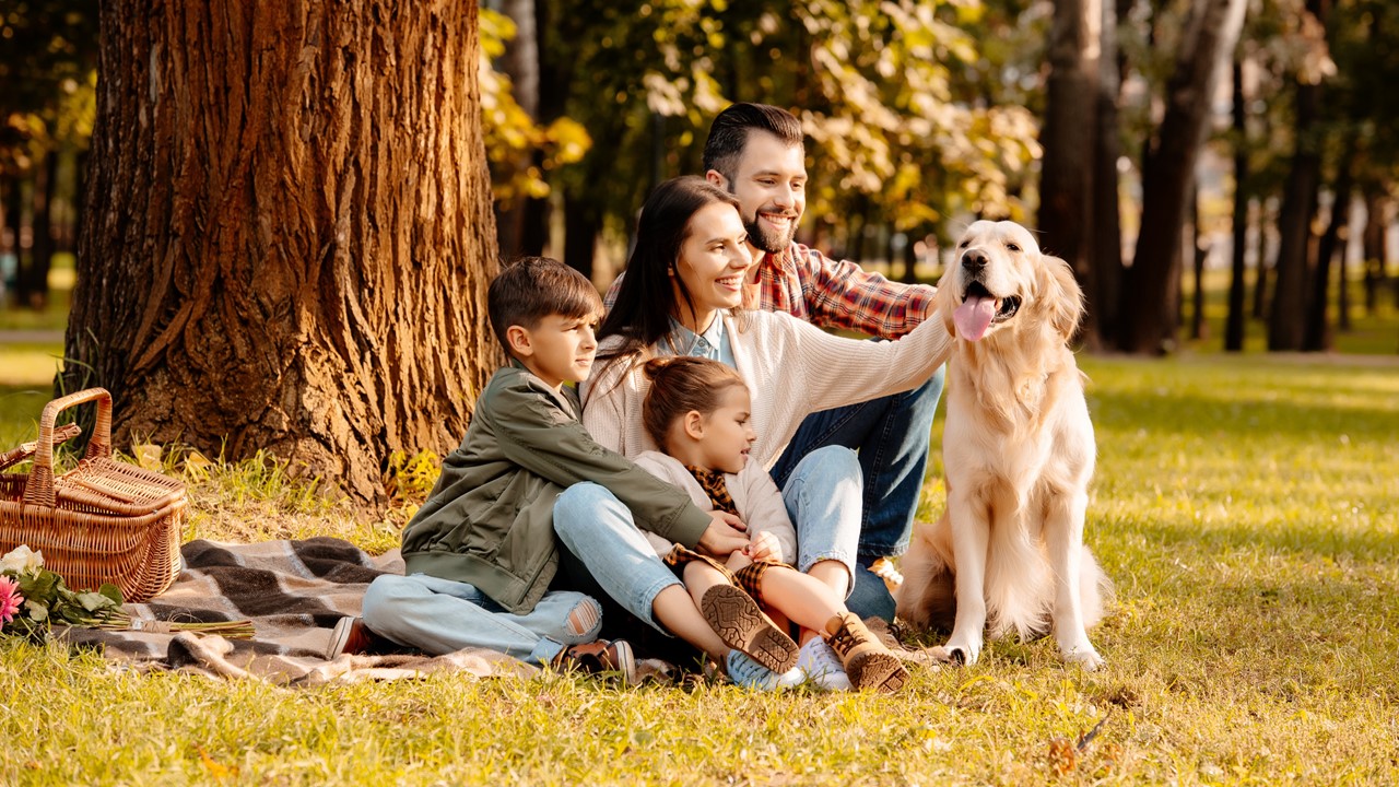 A family and their dog enjoing a fall picnic - Lafayette apartments - apartments in Lafayette La