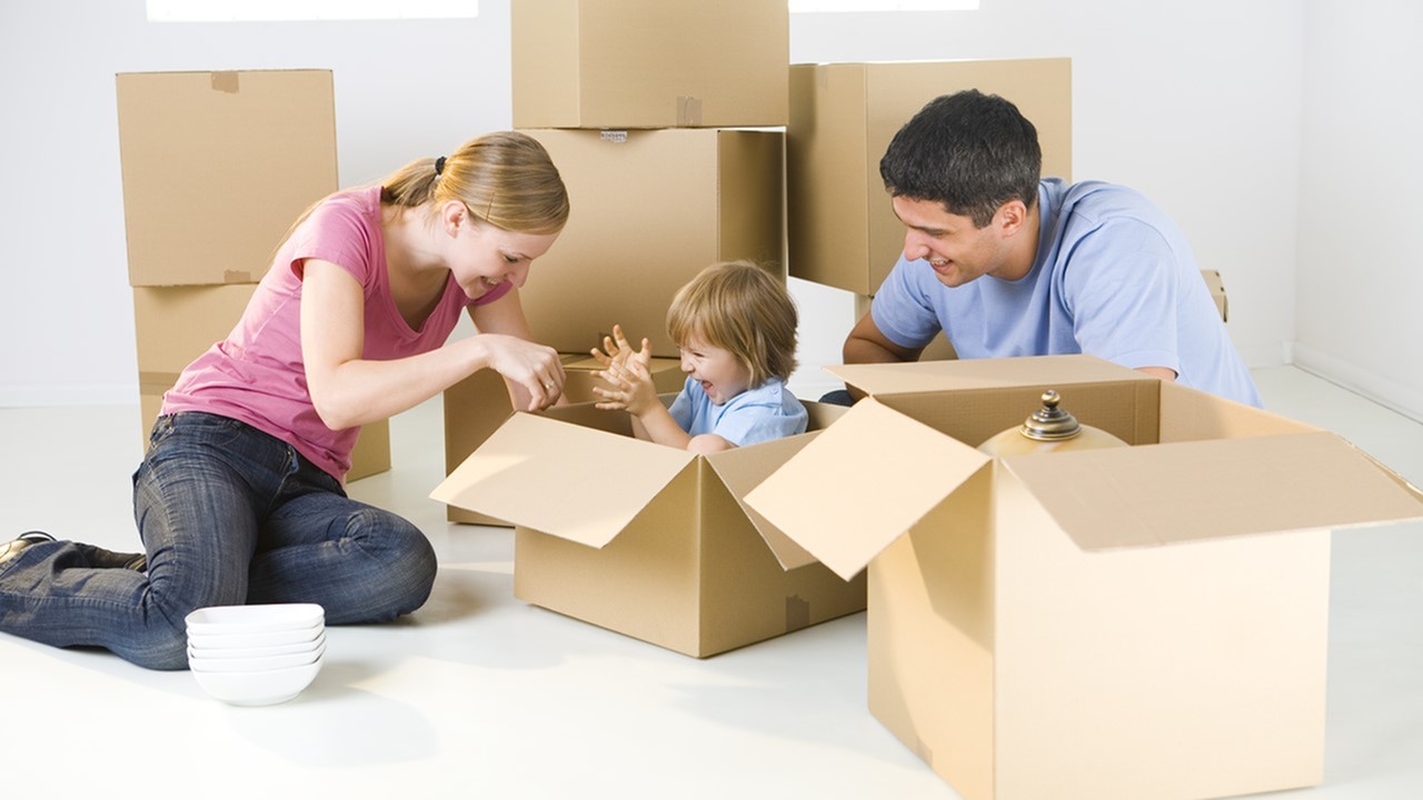 image of a mom and dad playing with child in an empty moving box - 2 bedroom apartments lafayette la