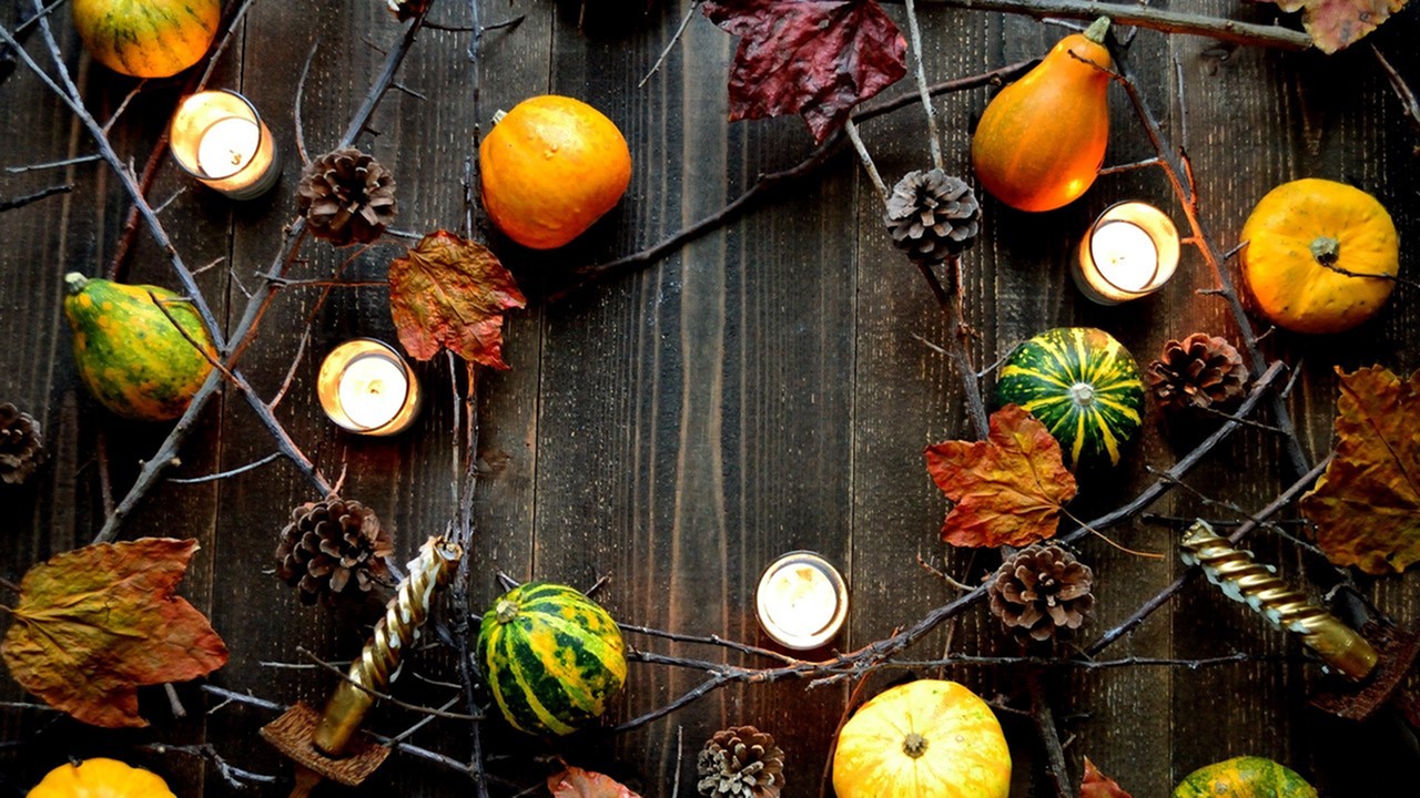 Fall decorations on a dark wood table(leaves, candles branches and gords) - Lafayette Gardens - Apartments - Lafayette La